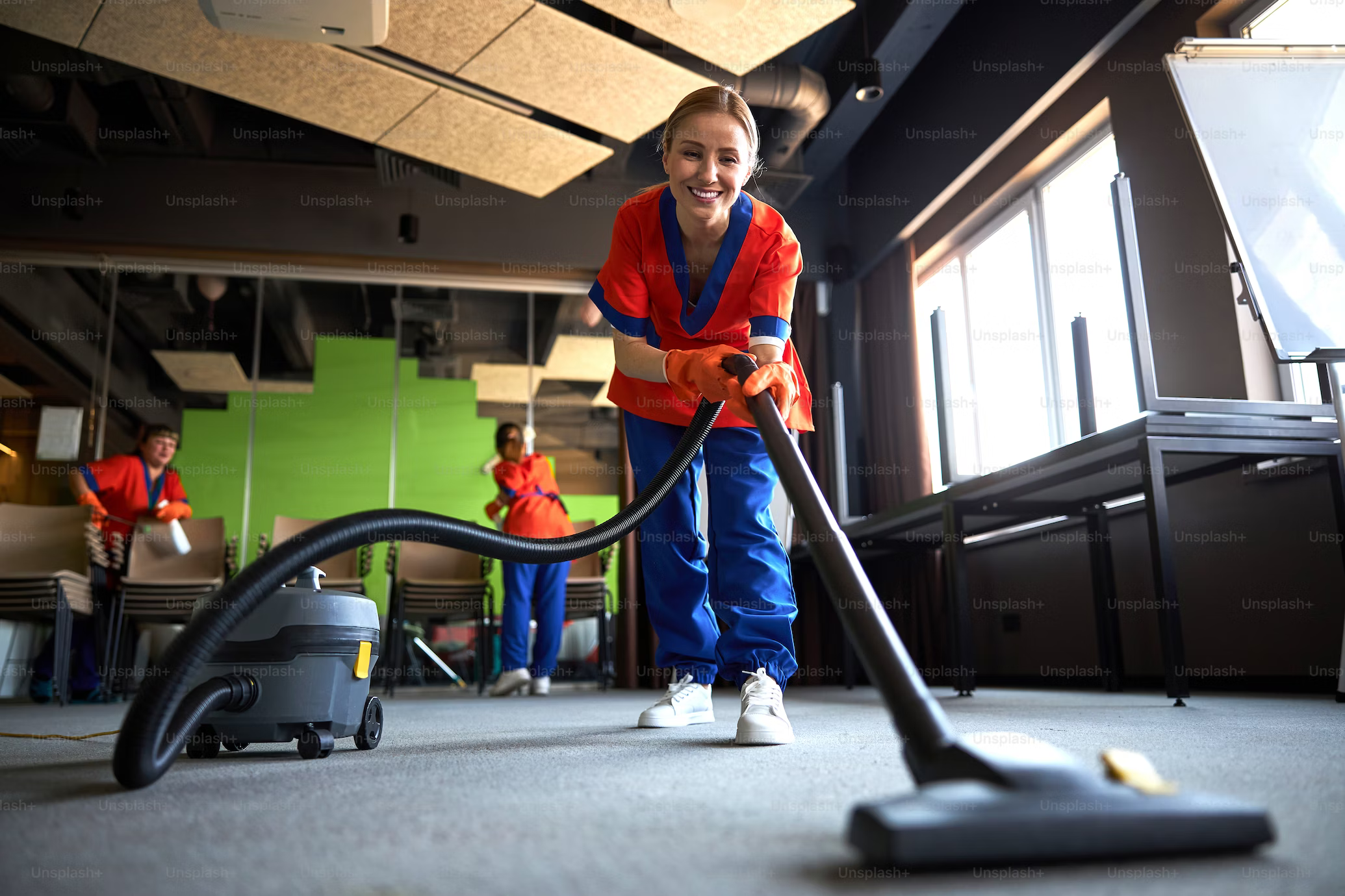 Woman vacuuming a carpet