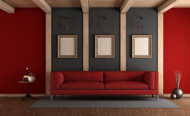 red sofa in a room with red and gray accent walls