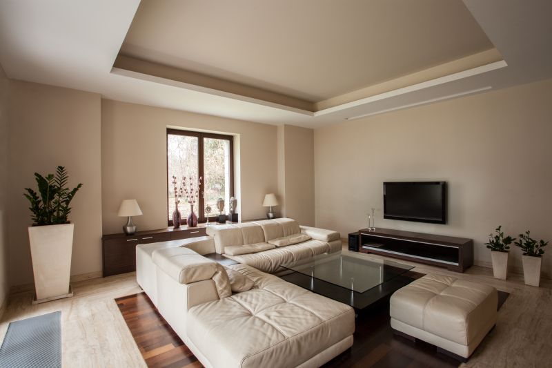 living room with beige walls and ivory furniture