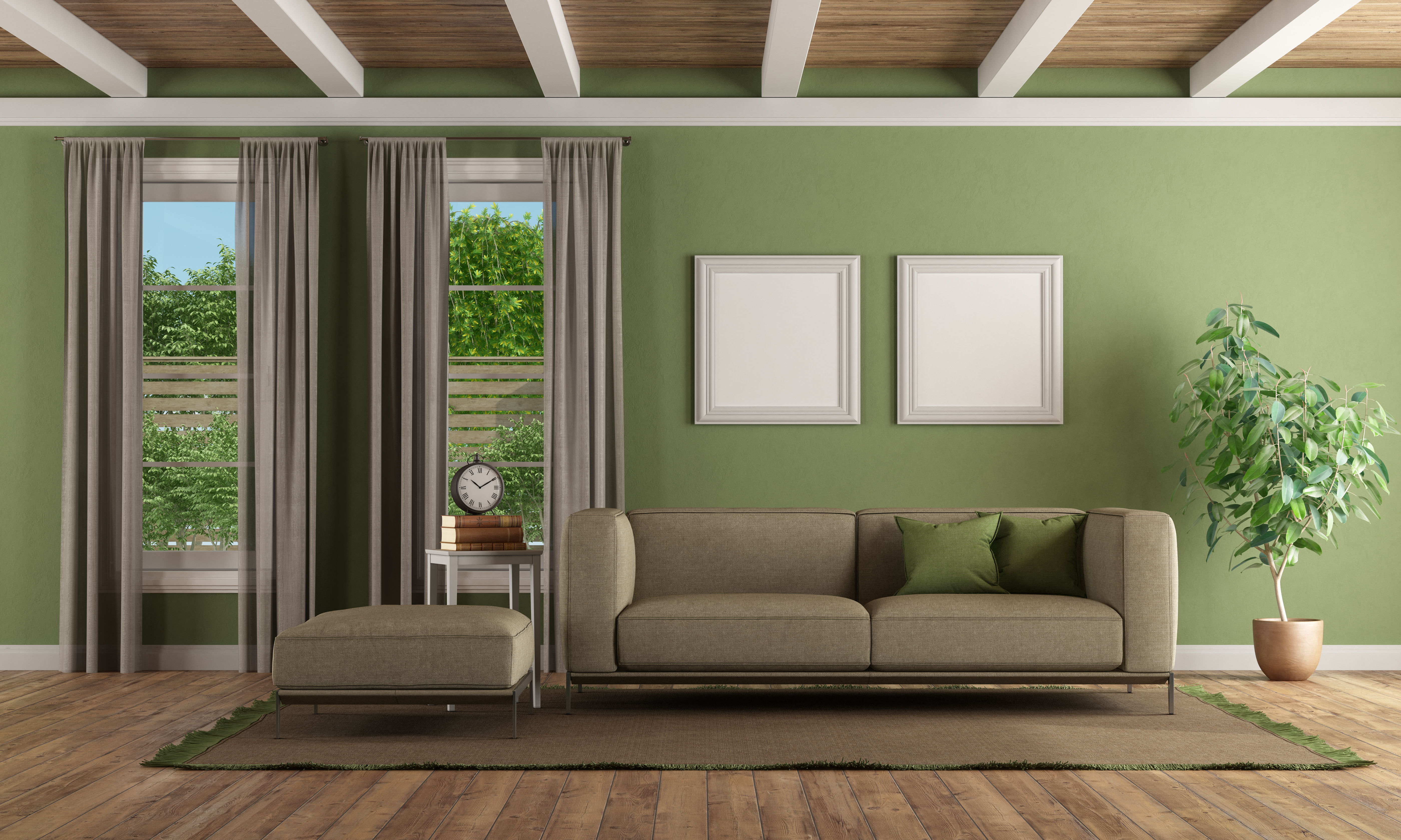 living room with green walls and a taupe couch