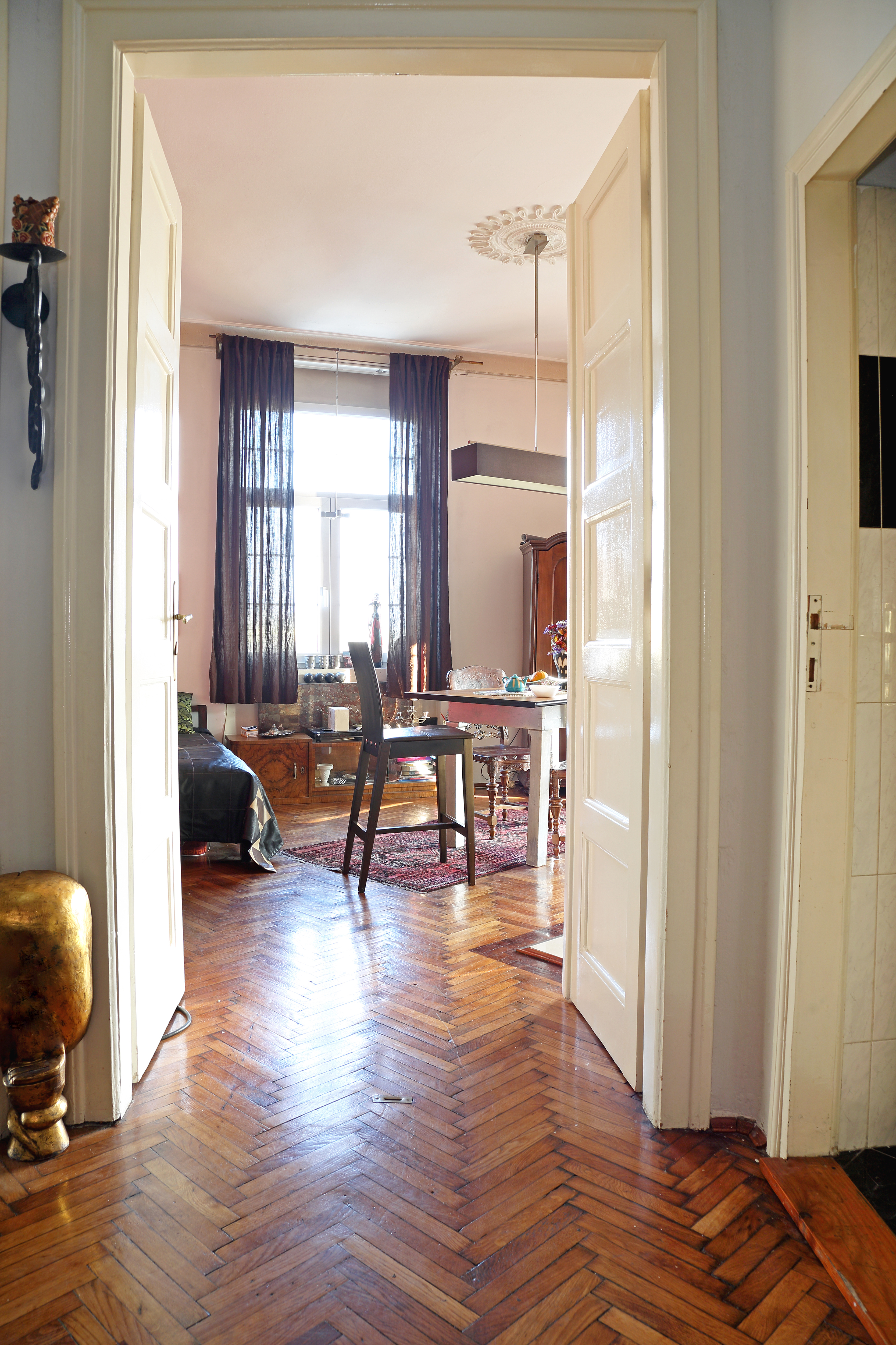 retro dining room with herringbone flooring with a high ceiling
